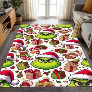 May include: A rectangular Christmas rug with a white background. The rug features a repeating pattern of the Grinch wearing a Santa hat, Christmas gifts, candy canes, and Christmas stockings. The rug is designed for indoor use.