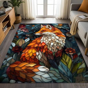 May include: A rectangular area rug featuring a mosaic-style fox design. The fox is rendered in shades of orange, white, and brown, surrounded by stylized leaves and flowers in blues, greens, and reds. The rug is designed for indoor use.