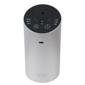May include: A silver and black electric diffuser with a digital display and a knob to adjust the mist output. The diffuser has a power button and a timer button. The diffuser has a small hole on the side for charging.