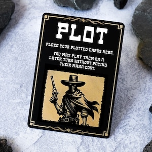 May include: A black card with gold trim and a gold silhouette of a masked gunslinger. The card reads "PLOT" and "PLACE YOUR PLOTTED CARDS HERE. YOU MAY PLAY THEM ON A LATER TURN WITHOUT PAYING THEIR MANA COST."