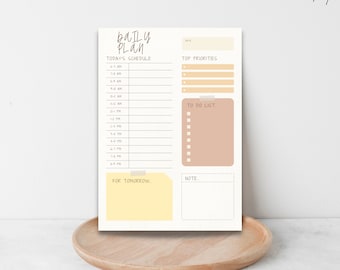 May include: A printable daily planner with sections for today's schedule, top priorities, to do list, and notes. The planner has a yellow and brown color scheme.