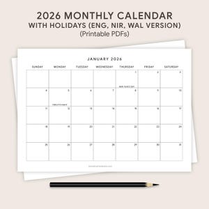 May include: A printable 2026 monthly calendar with holidays, featuring a clean, minimalist design. The calendar is white with black text, including the month of January. A black pencil rests at the bottom.