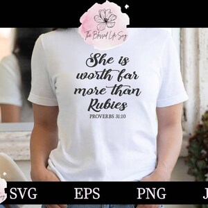 May include: White t-shirt with black text that reads "She is worth far more than Rubies" and "Proverbs 31:10".