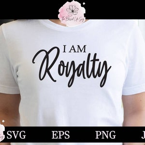 May include: White t-shirt with the text "I AM Royalty" in black cursive lettering.