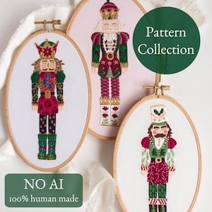 May include: Three embroidered nutcracker figures in wooden hoops. The nutcrackers are in red, green, and gold, with intricate details. The text "Pattern Collection" is on a green circle. The text "NO AI 100% human made" is on a green rectangle.