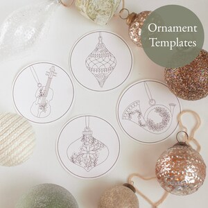 May include: Circular ornament templates with various designs, including a violin, a French horn, and different ornament shapes. The text "Ornament Templates" is visible. The templates are surrounded by decorative Christmas ornaments.