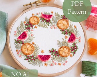 May include: Embroidered citrus fruit wreath on white fabric, featuring orange slices and pink grapefruit segments. The design is framed in a wooden hoop. Text on the image reads "PDF Pattern" and "NO AI 100% human made".