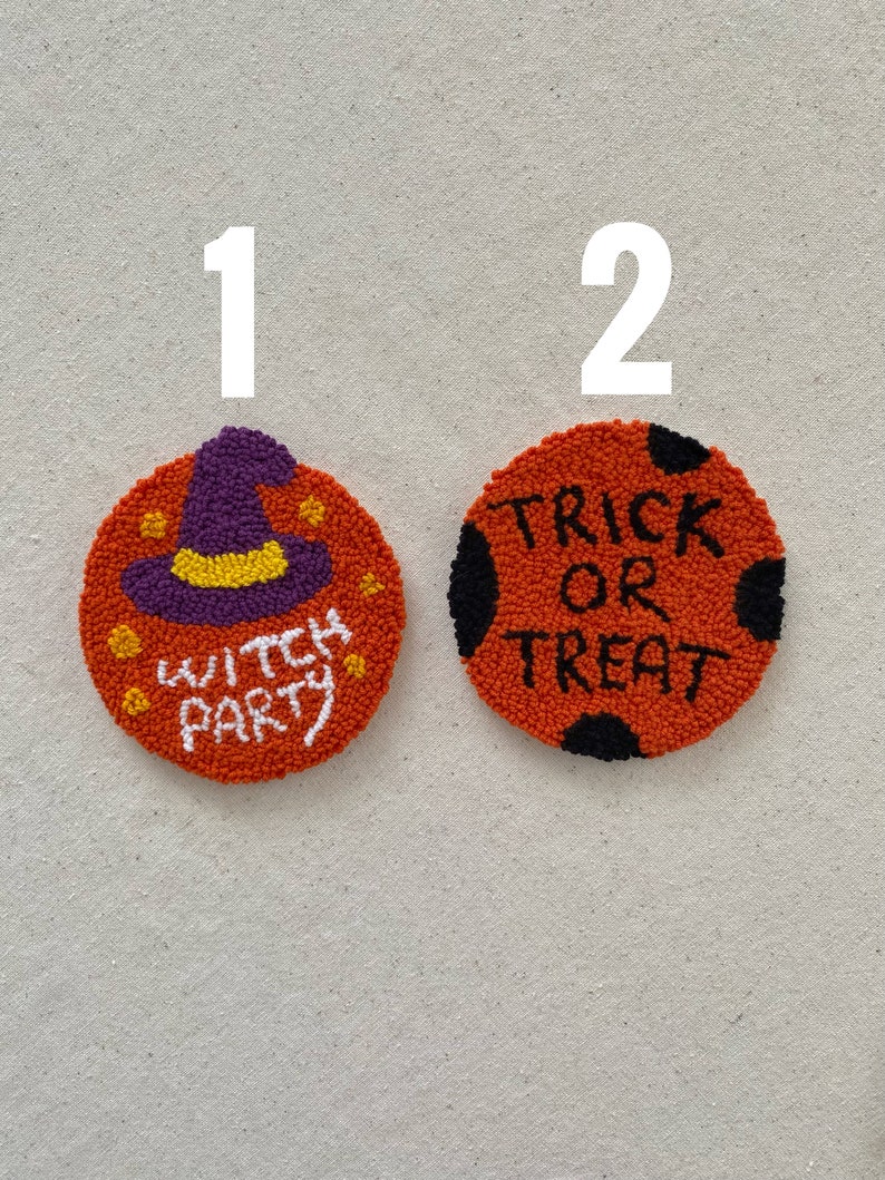 May include: Two orange and black Halloween themed needlepoint ornaments. The first ornament features a purple witch hat with a yellow brim and the text "Witch Party". The second ornament features black polka dots and the text "Trick or Treat".