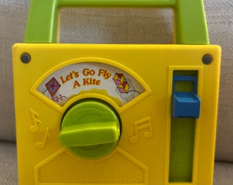 Vintage 1978 Fisher Price Wind up Radio Music Toy “Let’s Go Fly a Kite”