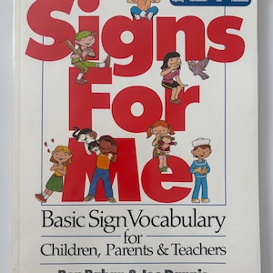 May include: A book titled "Signs For Me" with red lettering and illustrations of children. The book's subtitle reads "Basic Sign Vocabulary for Children, Parents & Teachers." The cover also lists an index in 8 languages.