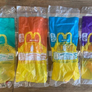 Vintage 1990’s McDonald’s Happy Meal Toys Dinosaurs Dino-Motion toys NIP NRFP Bilingual Packaging French/English