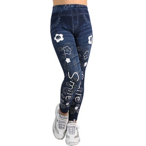May include: Blue denim leggings with white flowers and the word "Smile" printed on the side.