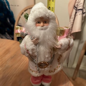 pink santa figurine statue