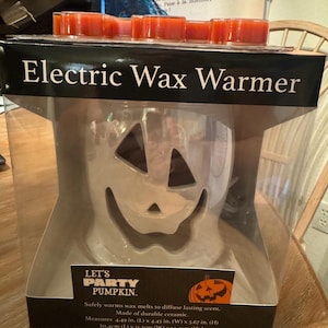 a  ghost candle wax warmer electric w wax melts