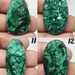 May include: Four polished malachite gemstones with unique patterns. The stones are various shapes, including oval and teardrop, and display a range of dark and light green hues. The natural patterns resemble swirling lines and textures, showcasing the stone's organic beauty.