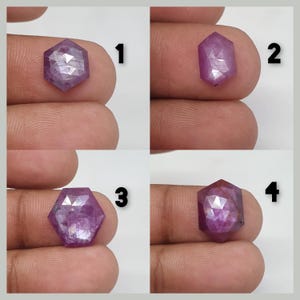May include: Four close-up images of faceted, hexagonal gemstones. The gems are a deep pinkish-purple color and appear to be held between fingers. Each stone has a unique internal pattern and reflective facets, showcasing their cut and clarity.
