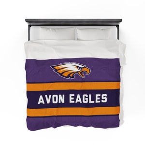 May include: Purple and orange striped bedding with an eagle logo and the text "AVON EAGLES".