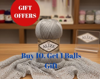 May include: A ball of grey Alize Sal yarn with a decorative label, displayed with a matching knitted scarf. The image includes a red circle with the words "GIFT OFFERS" and the text "Buy 10, Get 1 Balls Gift".
