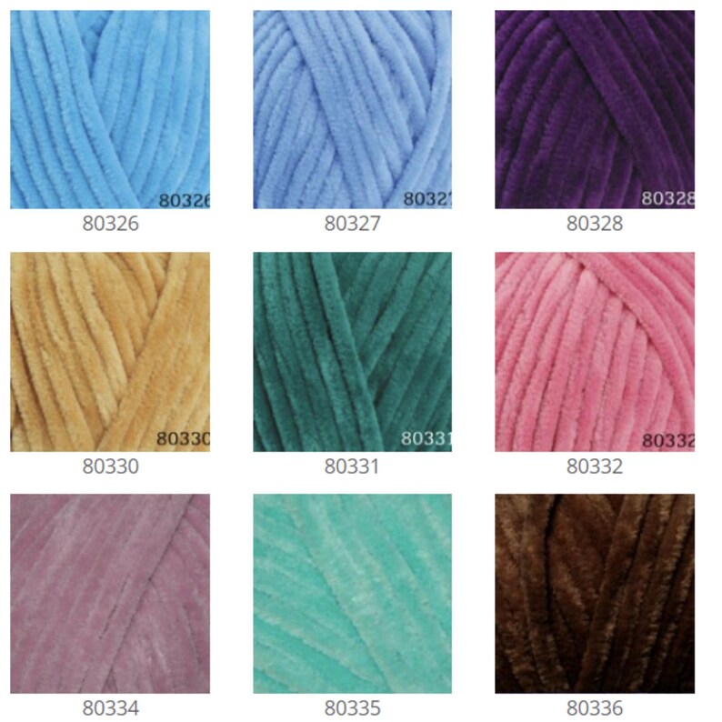 May include: A collection of 12 yarn skeins in various colors, including light blue, purple, gold, green, pink, brown, and gray. Each skein is labeled with a number.