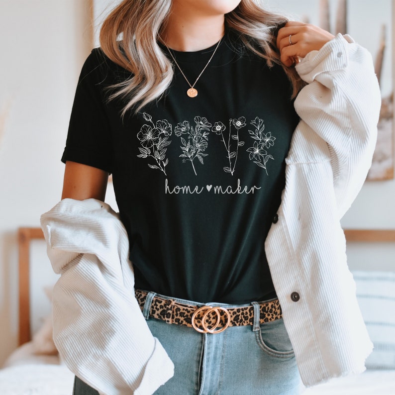 May include: Black t-shirt with a white floral design and the text "home &hearts; maker".