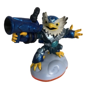 May include: A blue and silver Skylanders figure of a bird-like creature with a large blue cannon. The figure is standing on a cloud-shaped base.