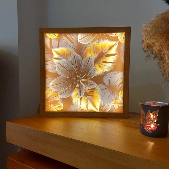 This designer end table also functions as a Lightbox for product