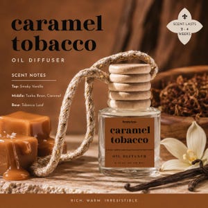 May include: A clear glass oil diffuser with a wooden cap and a rope for hanging. The label reads "caramel tobacco" and lists scent notes. Caramel candies and vanilla beans are arranged around the diffuser. The text says the scent lasts 2-4 weeks.