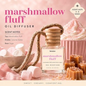 May include: A clear glass oil diffuser with a wooden cap and a braided rope. The label reads "marshmallow fluff" with scent notes: marshmallow fluff, caramel, butter, and sugar. The diffuser is 0.33 fl oz (10 ml).