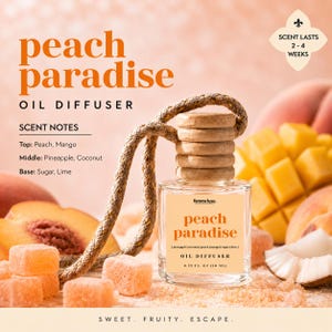 May include: A clear glass oil diffuser with a wooden cap and a rope hanger. The label reads "peach paradise" with scent notes of peach, mango, pineapple, coconut, sugar, and lime. The image includes peaches, mangoes, and coconut.