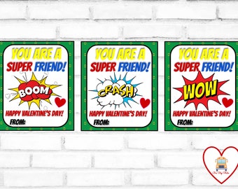 May include: Three printable Valentine's Day cards with a superhero theme. Each card has a green border and features the text "You are a Super Friend!" with a comic book style speech bubble. The speech bubbles say "Boom", "Crash", and "Wow".