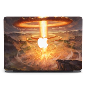 May include: A laptop skin with a fiery explosion in the center, surrounded by a swirling cloud of smoke and dust. The explosion is set against a backdrop of a desert landscape.