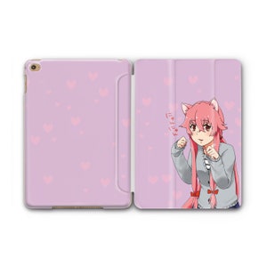 May include: A pink and white iPad case featuring a cartoon image of an anime character with pink hair and cat ears. The character is wearing a grey sweater and a red bow. The text "にゃー" is written in Japanese on the case.