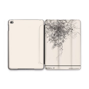 May include: A white iPad case with a black outline. The back of the case features a black and white map of Rome, Italy. The text "ROMA, IT" and "41°53'35"N 12°28'58"E" are printed at the bottom of the case.