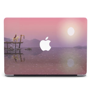 May include: Pink laptop skin featuring a sunset scene with a white Apple logo. The scene depicts a solitary figure on horseback riding towards a pier on a lake.