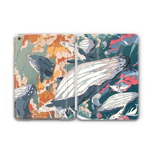 May include: A colorful illustration of a group of whales swimming in a swirling pattern of blue, orange, and pink. The whales are depicted in a stylized, almost abstract way, with their bodies blending into the background.