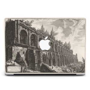 May include: A black and white vintage engraving of an ancient Roman structure with arches and columns. The image is printed on a laptop skin with a white Apple logo.