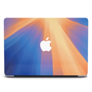 May include: A laptop computer with a blue and orange abstract design on the lid. The Apple logo is visible in the centre of the lid.