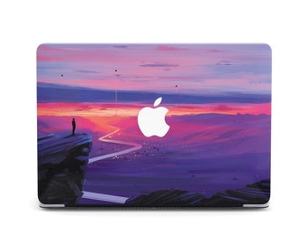 May include: A laptop skin with a purple and pink sunset landscape and a white Apple logo. A silhouette of a person stands on a cliff overlooking a winding road.