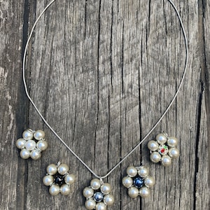 Beautiful silver bead flower pendant on silver necklace