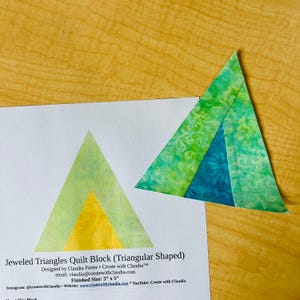 May include: A quilt block pattern for a triangular shaped quilt block called "Jeweled Triangles". The pattern is designed by Claudia Porter and is 5 inches by 5 inches.