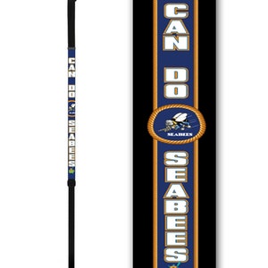 May include: A black walking cane with a blue and gold design featuring the words "Can Do Seabees" and a logo of a bee with the words "Seabees".