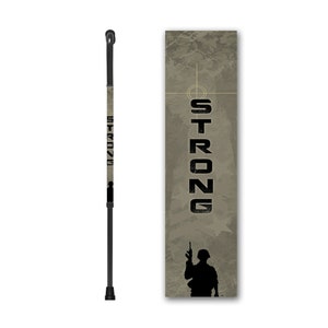 May include: A black walking stick with a camouflage pattern and the word "STRONG" printed on it. The stick is adjustable and has a rubber tip.