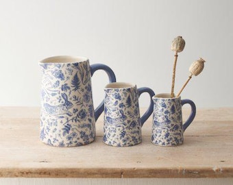 Ceramic blue detailed jug with either dainty flowers, leaves and hares or a Coastal themed design to choose from