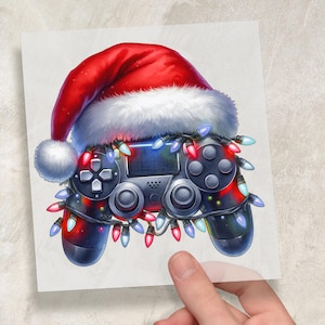 May include: A festive illustration of a video game controller adorned with a Santa hat and string lights. The controller is black with gray buttons and is wrapped in colorful Christmas lights, creating a holiday gaming theme.