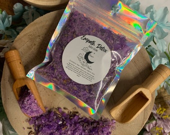 May include: Purple bath salts in a clear plastic bag with a white label that reads "Empath Detox Bath Soak". The label also includes directions for use and a crescent moon graphic.