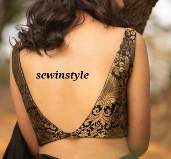 her saree pallu slipping off her shoulder to reveal her cleavage