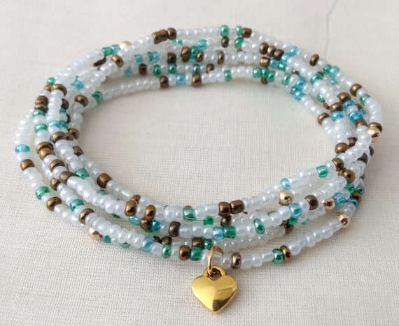 Friendship Stretch Bracelet Set of Six White with Gold Tone Beads Friendship Stretch Bracelet Set of Six White with Gold Tone Beads