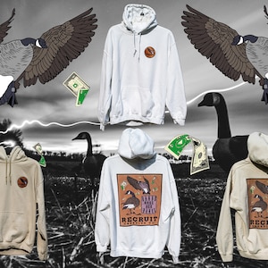 May include: Five hooded sweatshirts in various colors, including white and beige. The sweatshirts feature a graphic design of a goose with the text "Bands Make Her Fly" and "Recruit Creative Co."