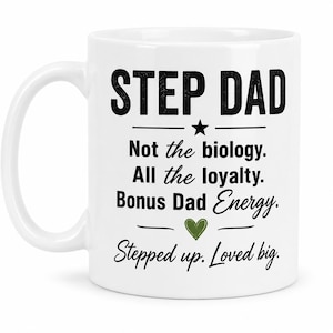 May include: White ceramic mug with the words "STEP DAD" in bold black letters. Below, the mug reads "Not the biology. All the loyalty. Bonus Dad Energy. Stepped up. Loved big." A star and heart graphic are also included.