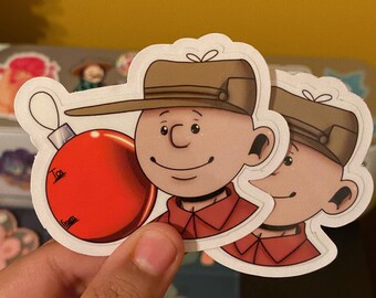 Pegatina navideña de Charlie Brown hecha por fans de SpxceDreamer